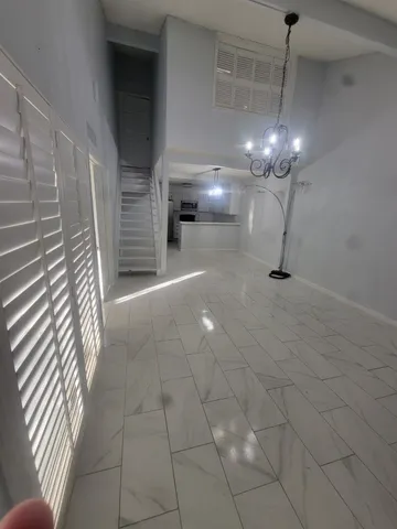 a view of a hallway with stairs