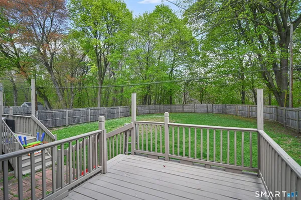 a view of a wooden deck with a trees