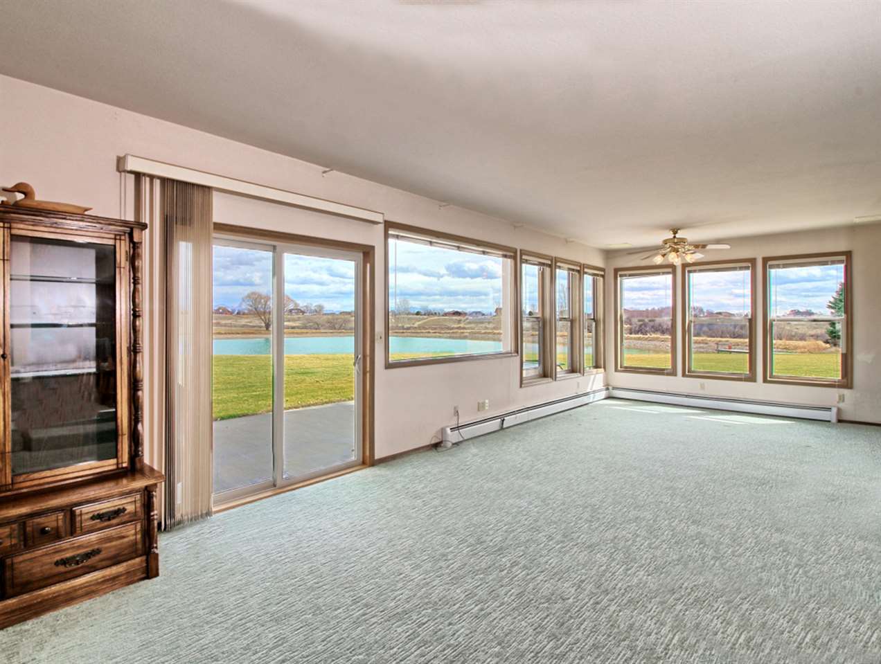 1420 18 Road Fruita, CO 81521 - Photo 23 of 42 a view of an empty room with wooden floor and a window