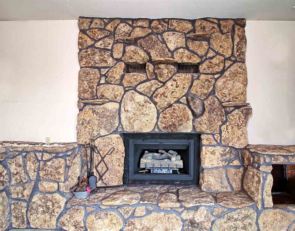 1420 18 Road Fruita, CO 81521 - Photo 26 of 42 a stone house with a fireplace in it