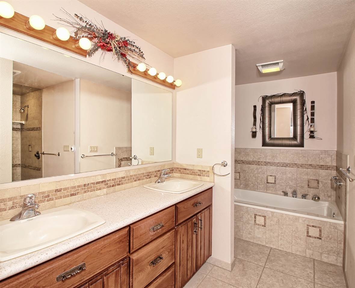 1420 18 Road Fruita, CO 81521 - Photo 28 of 42 a bathroom with a sink vanity and mirror