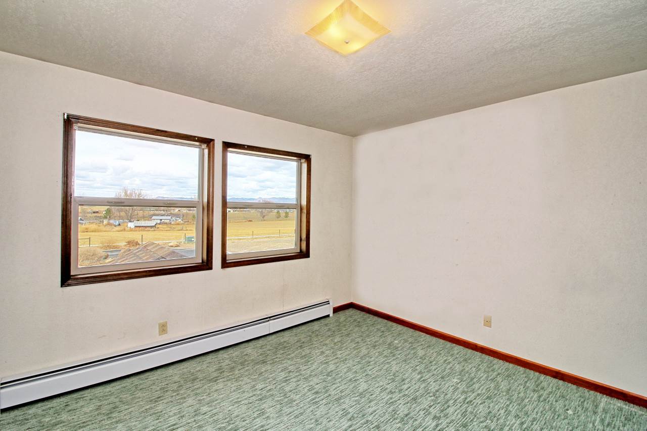 1420 18 Road Fruita, CO 81521 - Photo 32 of 42 a view of an empty room and window