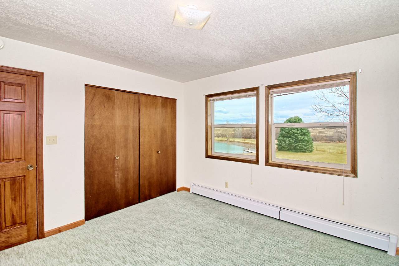 1420 18 Road Fruita, CO 81521 - Photo 33 of 42 a view of an empty room with a window