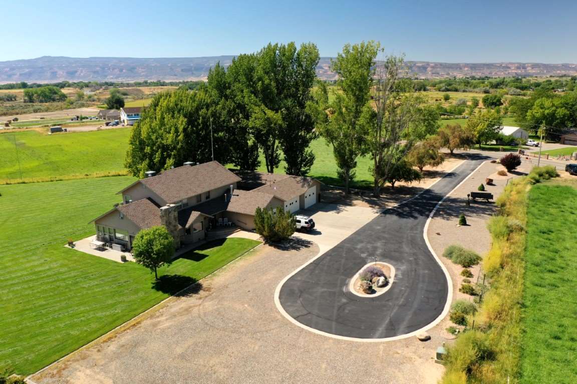 1420 18 Road Fruita, CO 81521 - Photo 35 of 42 an aerial view of a house with outdoor space patio and mountain view