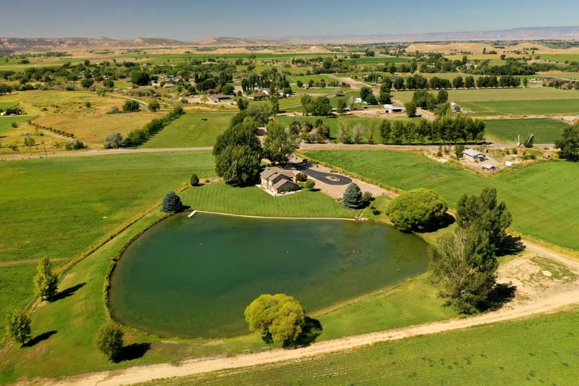 1420 18 Road Fruita, CO 81521 - Photo 38 of 42 a view of a lake with a houses