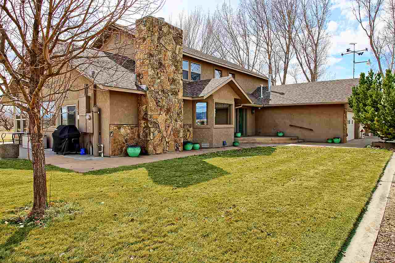1420 18 Road Fruita, CO 81521 - Photo 4 of 42 a front view of house with yard and trees