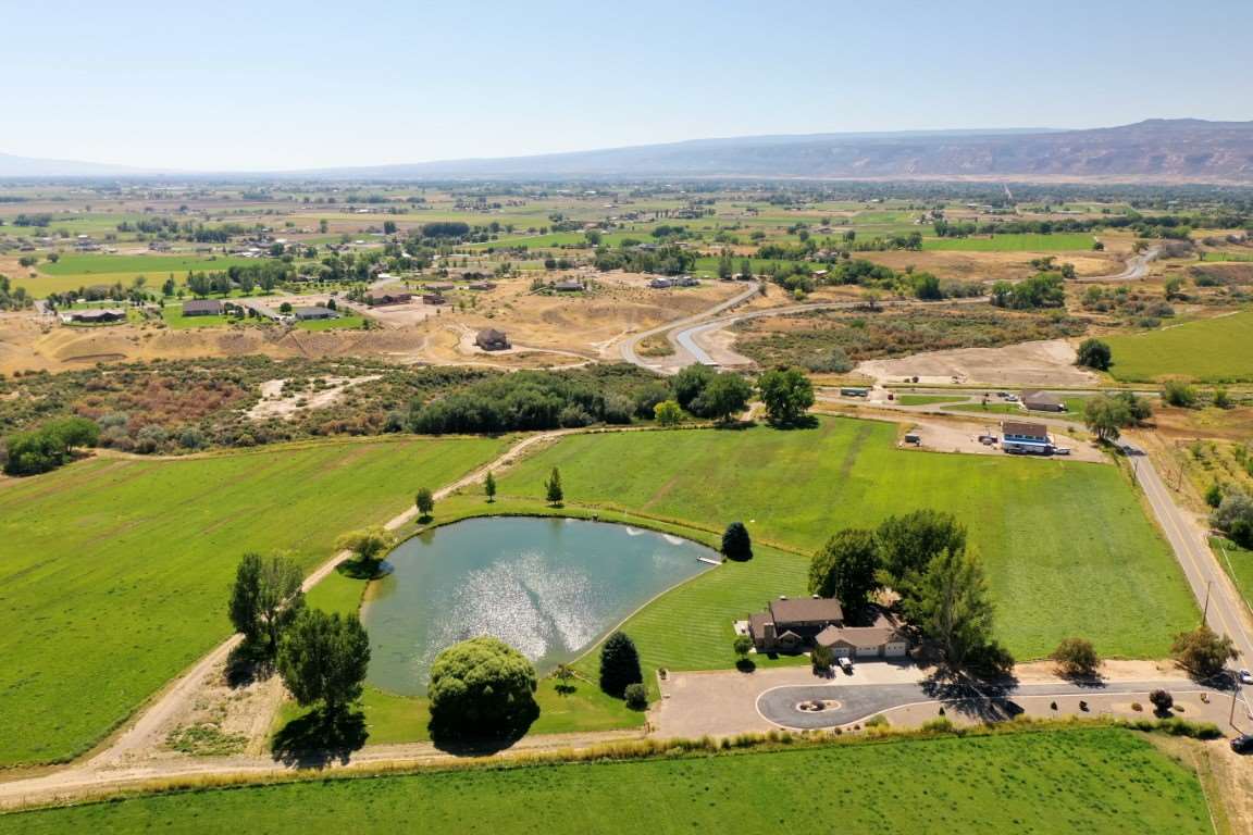1420 18 Road Fruita, CO 81521 - Photo 41 of 42 an aerial view of a houses with a lake view