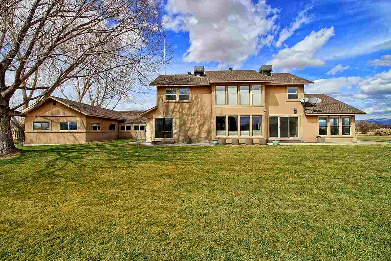 1420 18 Road Fruita, CO 81521 - Photo 6 of 42 a front view of a house with a garden