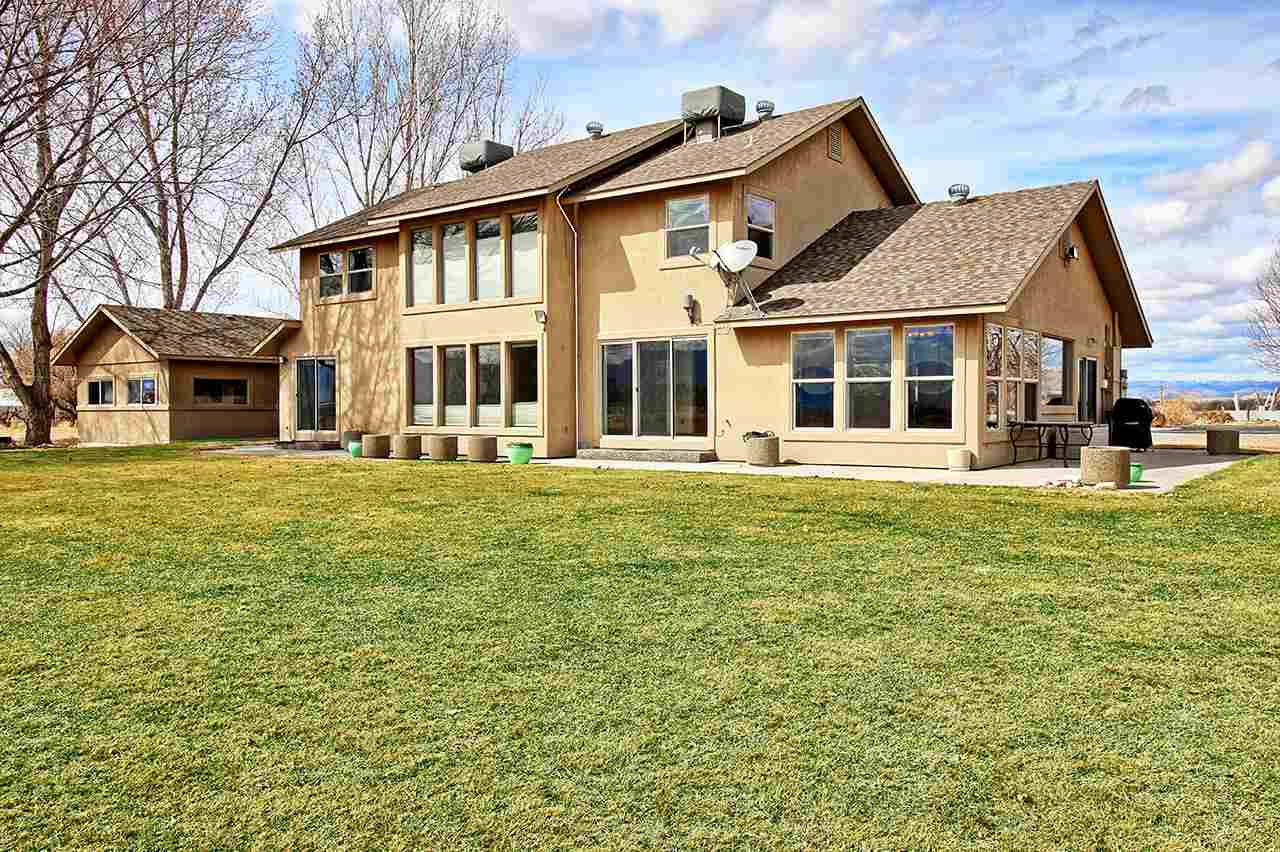 1420 18 Road Fruita, CO 81521 - Photo 7 of 42 a front view of a house with a garden