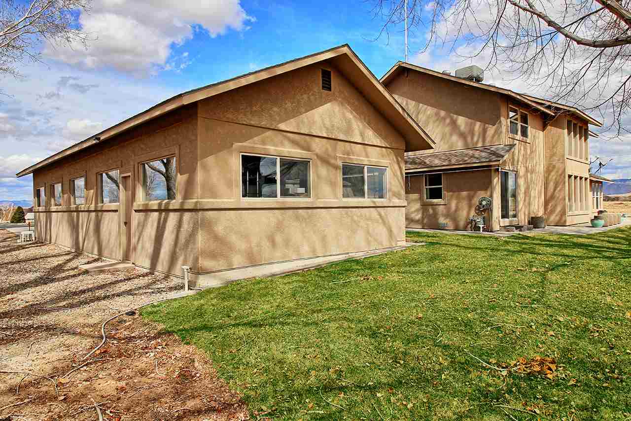 1420 18 Road Fruita, CO 81521 - Photo 9 of 42 a view of a house with backyard
