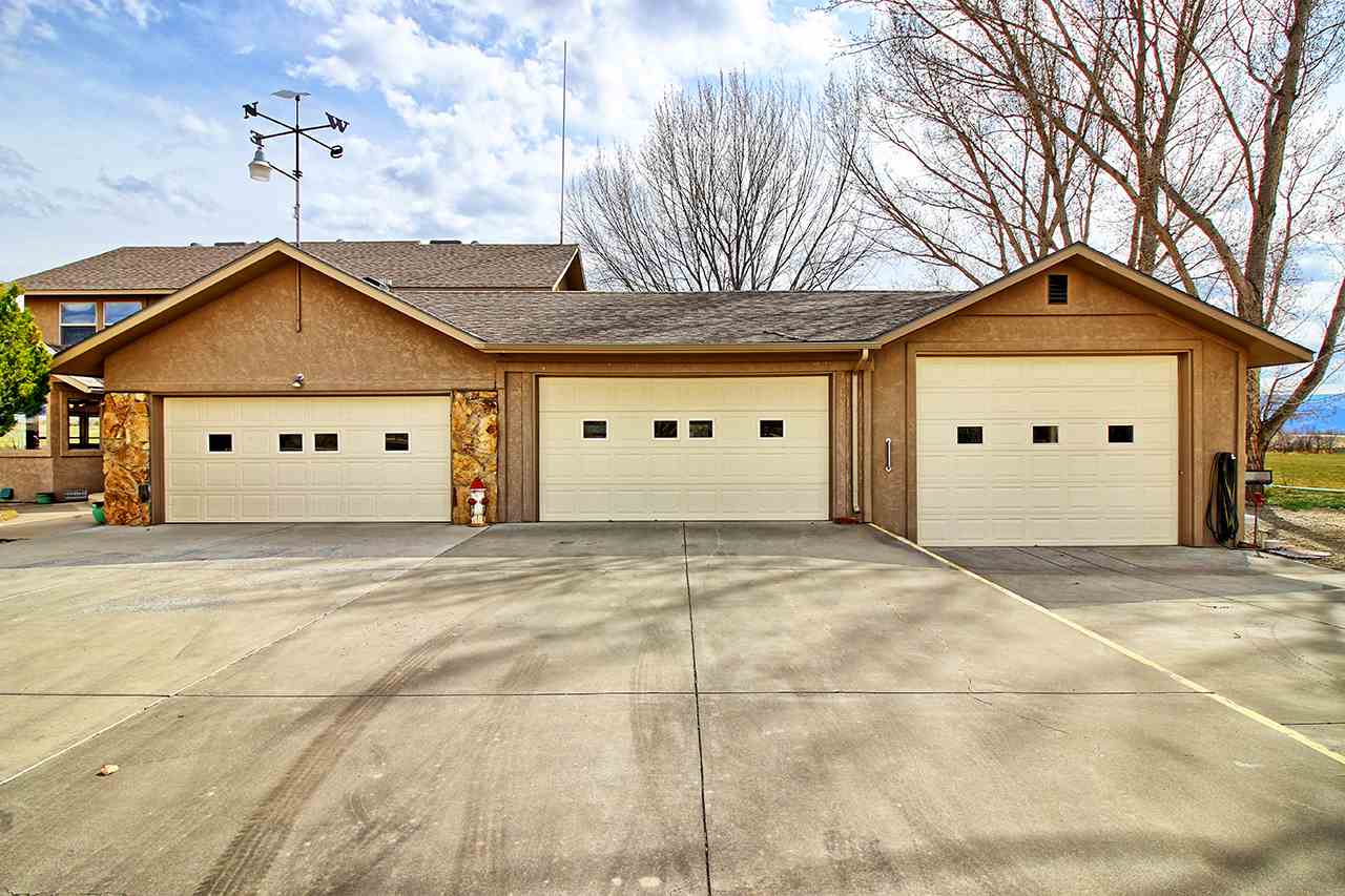 1420 18 Road Fruita, CO 81521 - Photo 10 of 42 a view of a white house with a large space