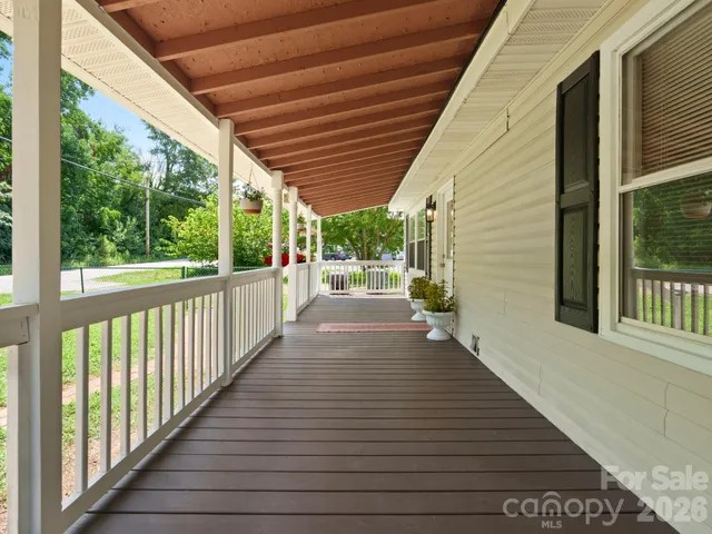 a view of a porch with wooden floor