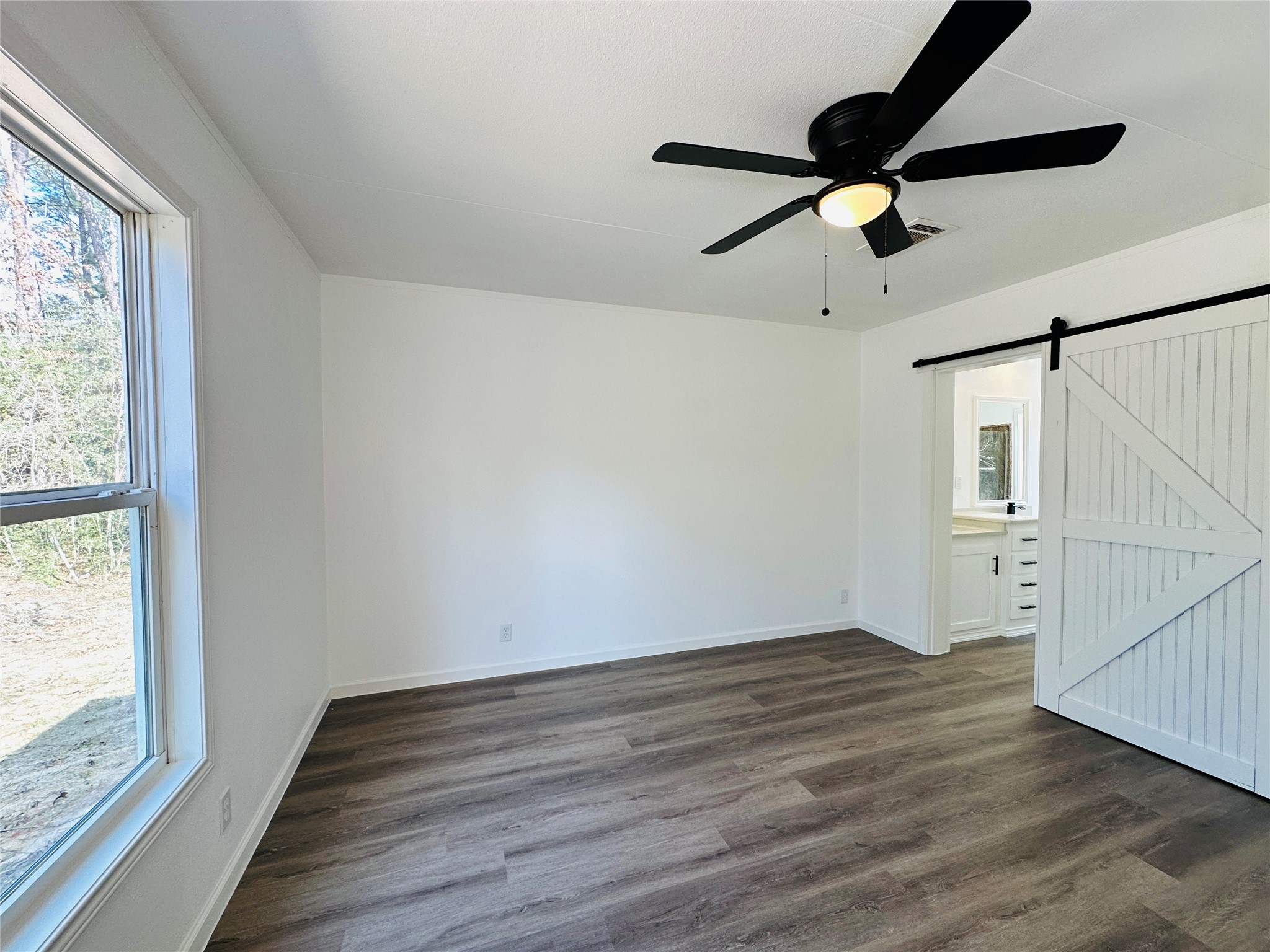 11269 Newton Circle Conroe, TX 77303 - Photo 13 of 39 a view of room with hardwood floor and window