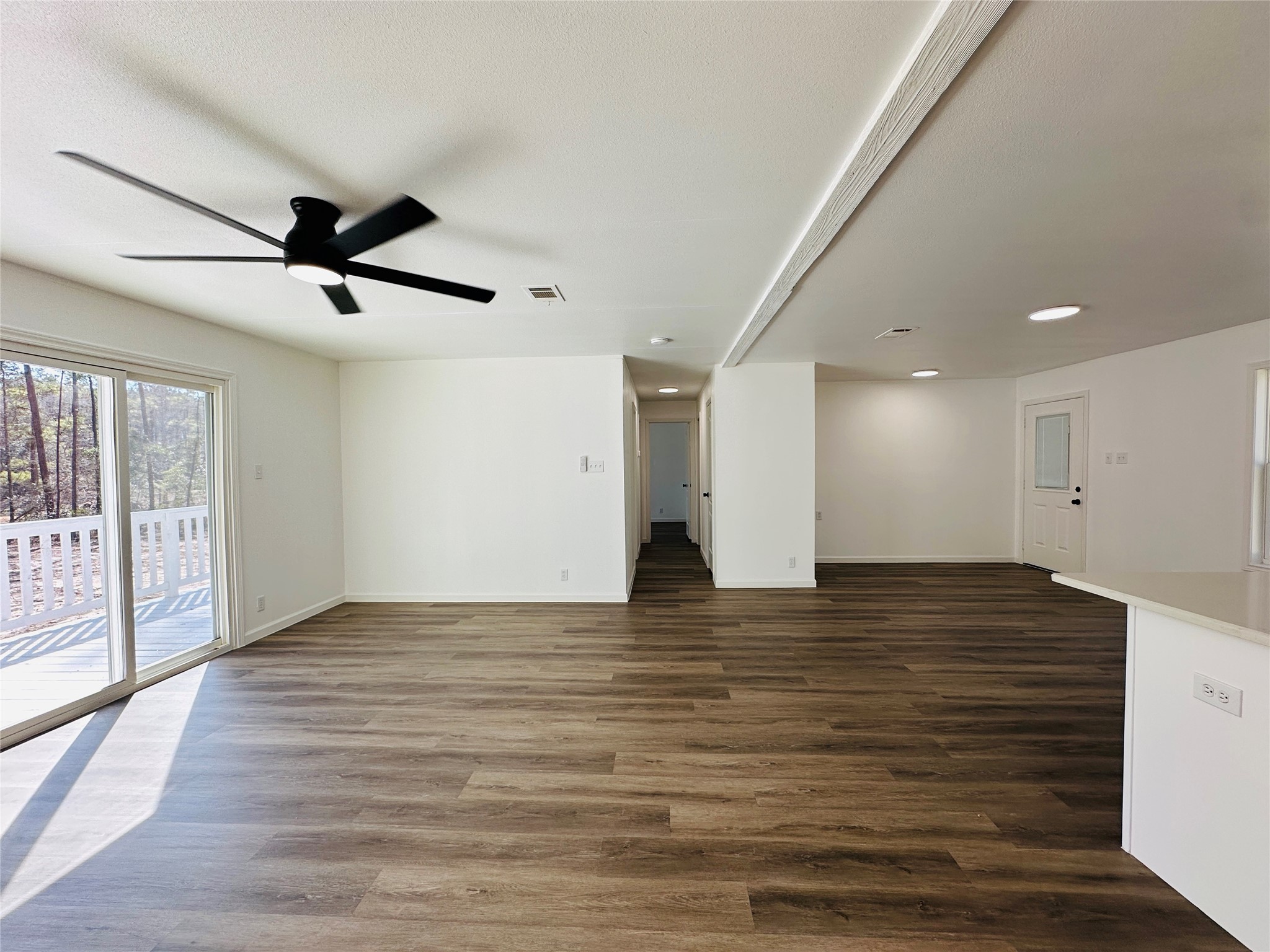 11269 Newton Circle Conroe, TX 77303 - Photo 19 of 39 a view of empty room with wooden floor and fan