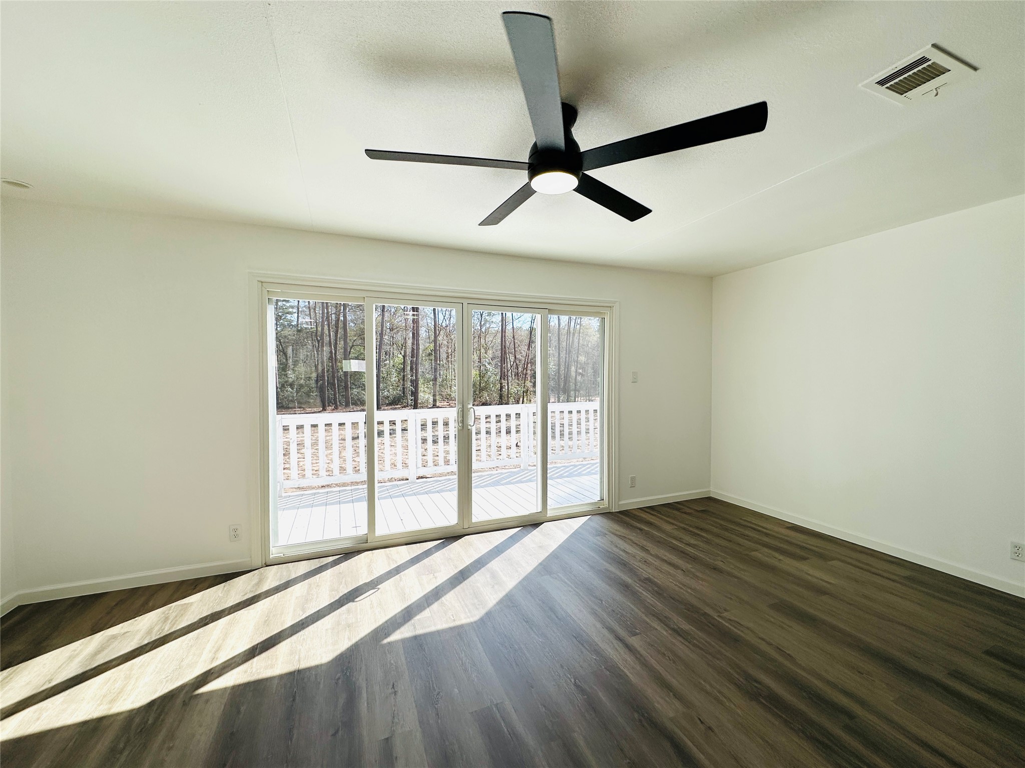 11269 Newton Circle Conroe, TX 77303 - Photo 20 of 39 a view of an empty room with wooden floor and a window
