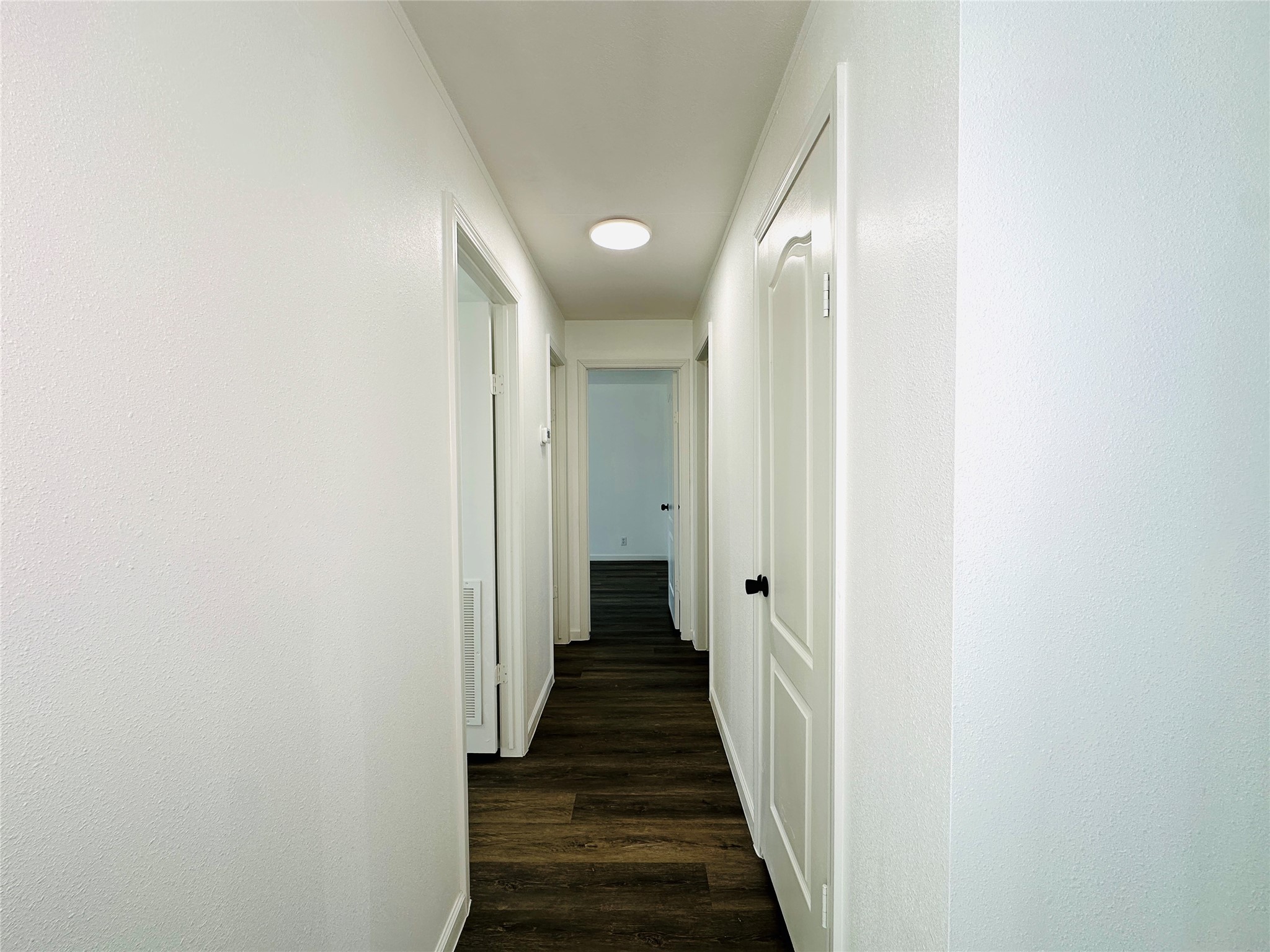 11269 Newton Circle Conroe, TX 77303 - Photo 22 of 39 a view of a hallway with wooden floor and staircase