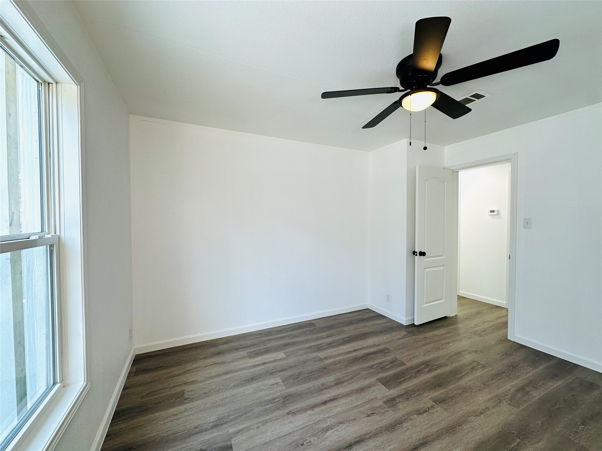 11269 Newton Circle Conroe, TX 77303 - Photo 27 of 39 a view of an empty room and wooden floor
