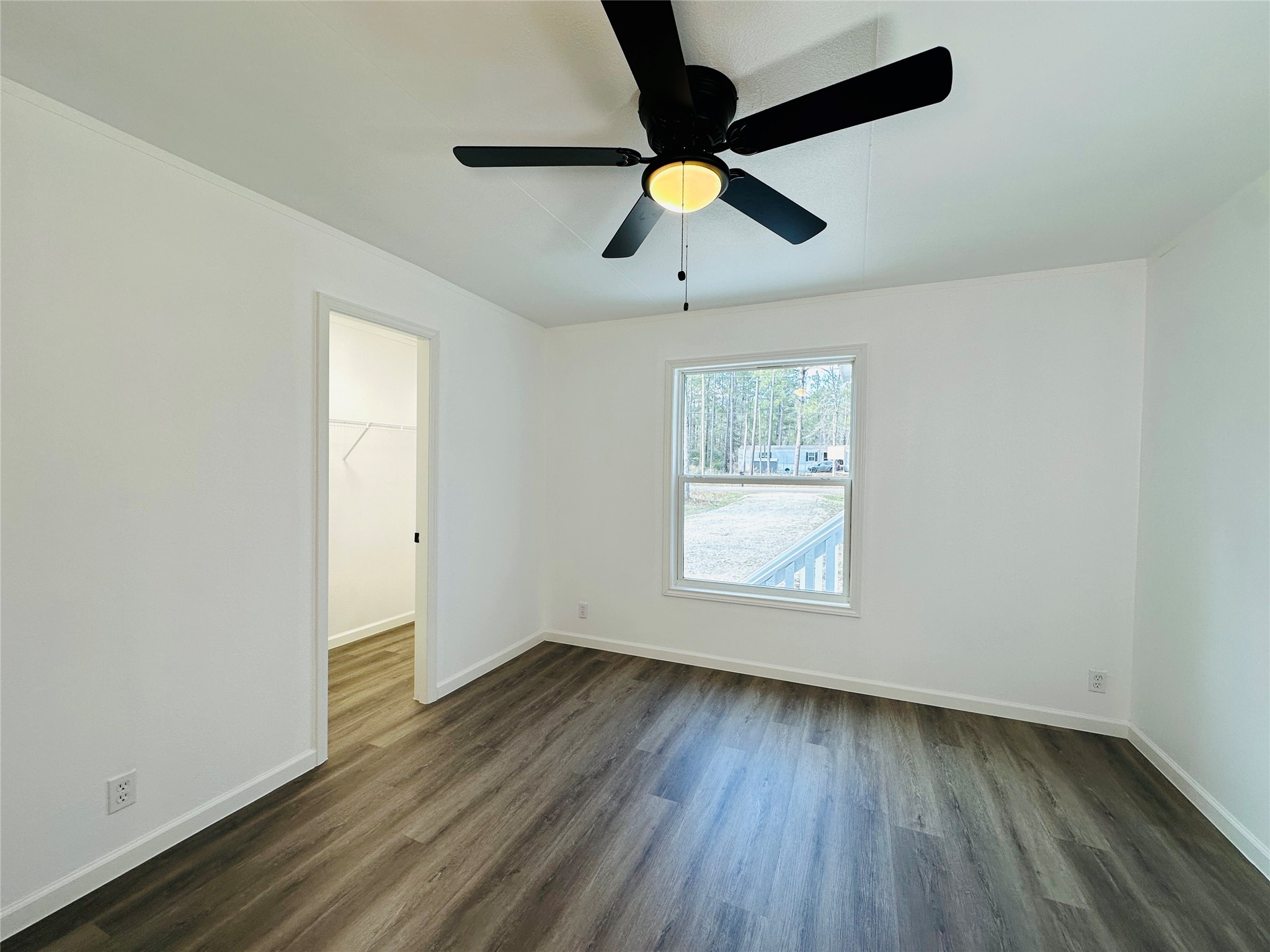 11269 Newton Circle Conroe, TX 77303 - Photo 28 of 39 wooden floor in an empty room with a window