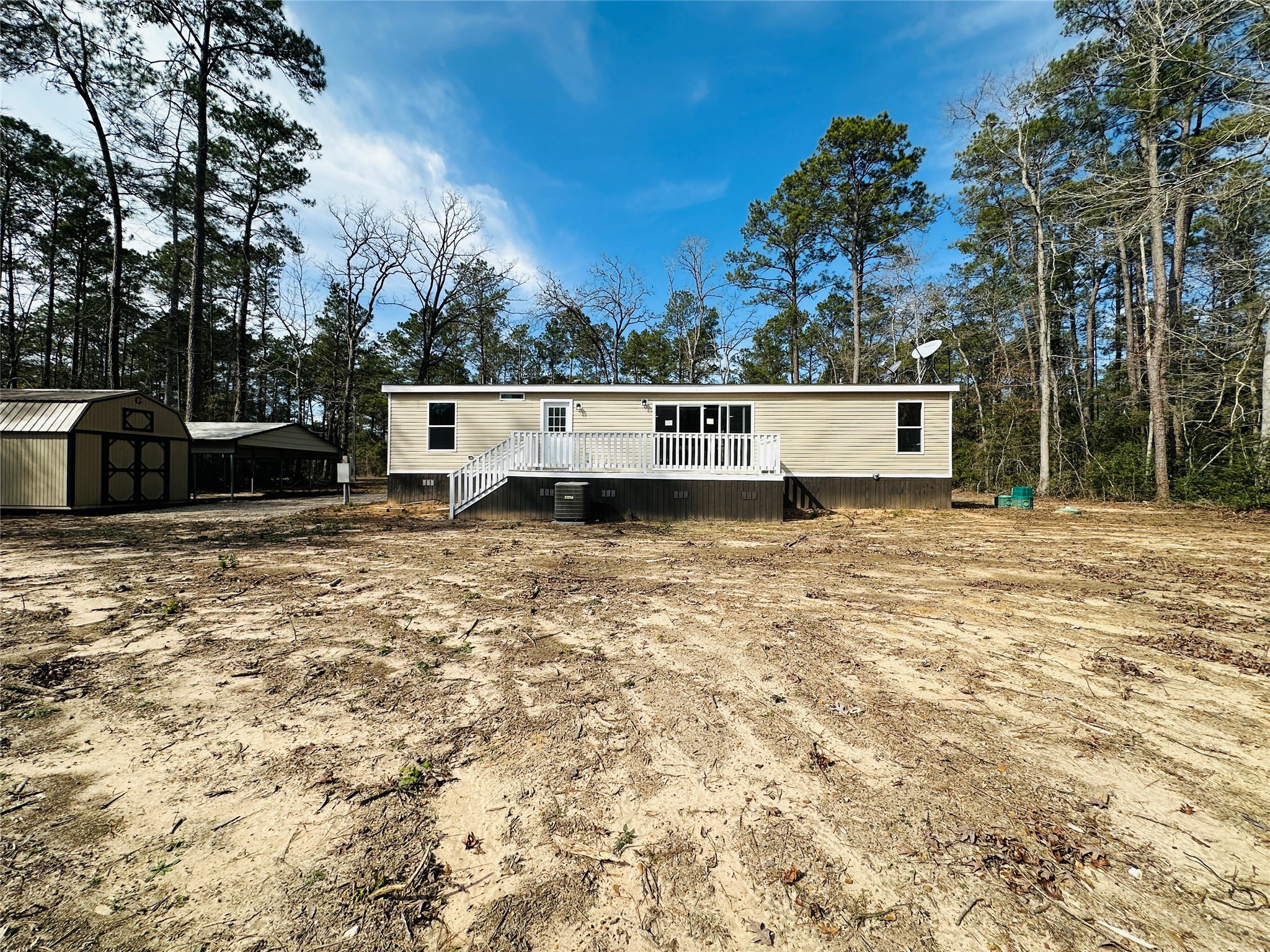 11269 Newton Circle Conroe, TX 77303 - Photo 35 of 39 a view of a white house with a yard