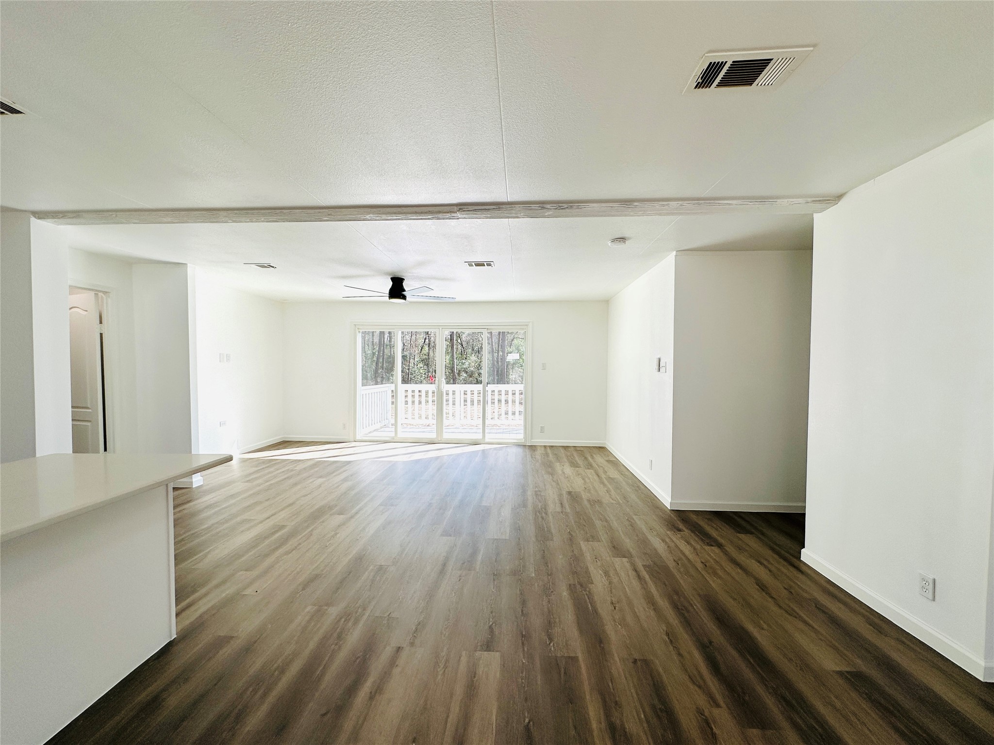 11269 Newton Circle Conroe, TX 77303 - Photo 5 of 39 wooden floor in an empty room with a window