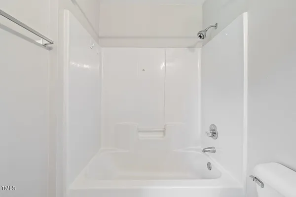 a close up of a bathtub curtain