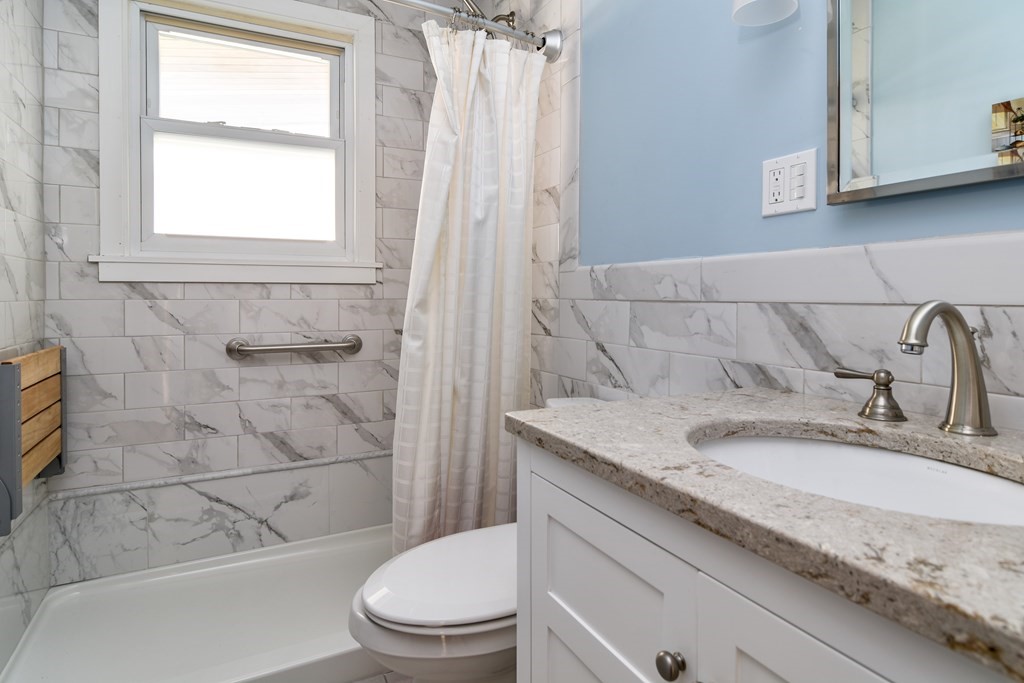 5 Rosenfeld Road Millis, MA 02054 - Photo 15 of 23 a bathroom with a granite countertop sink toilet and shower