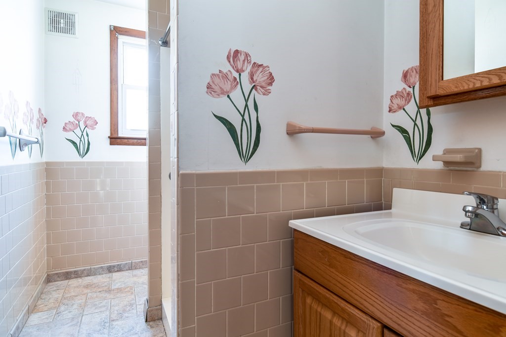 5 Rosenfeld Road Millis, MA 02054 - Photo 20 of 23 a bathroom with a sink and a mirror