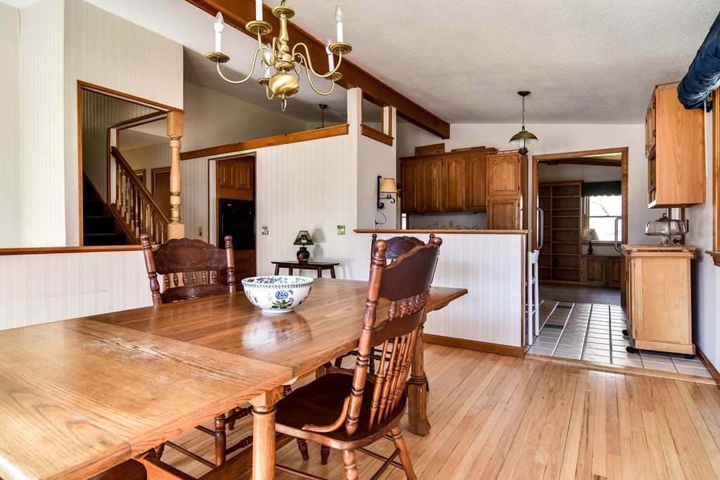 5 Rosenfeld Road Millis, MA 02054 - Photo 5 of 23 a view of a dining room with furniture and wooden floor