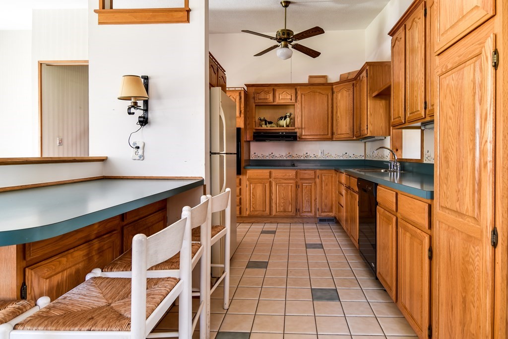 5 Rosenfeld Road Millis, MA 02054 - Photo 6 of 23 a kitchen with stainless steel appliances granite countertop a sink and cabinets