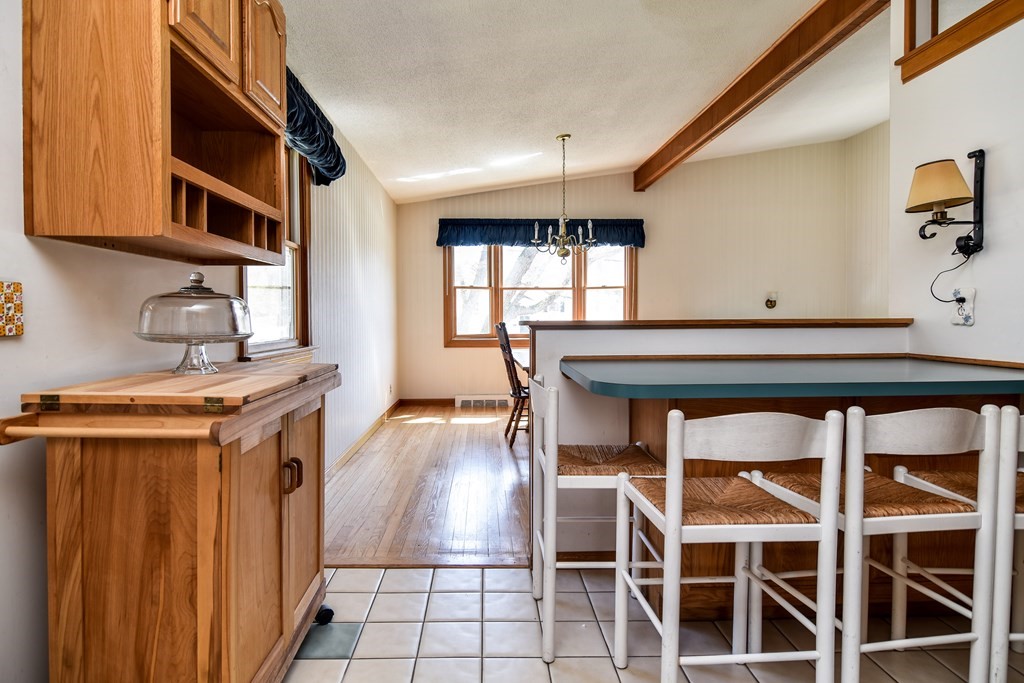5 Rosenfeld Road Millis, MA 02054 - Photo 7 of 23 a kitchen with a stove a refrigerator and cabinets