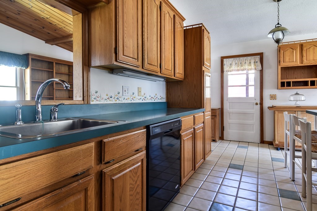 5 Rosenfeld Road Millis, MA 02054 - Photo 9 of 23 a kitchen with stainless steel appliances granite countertop a sink stove and cabinets