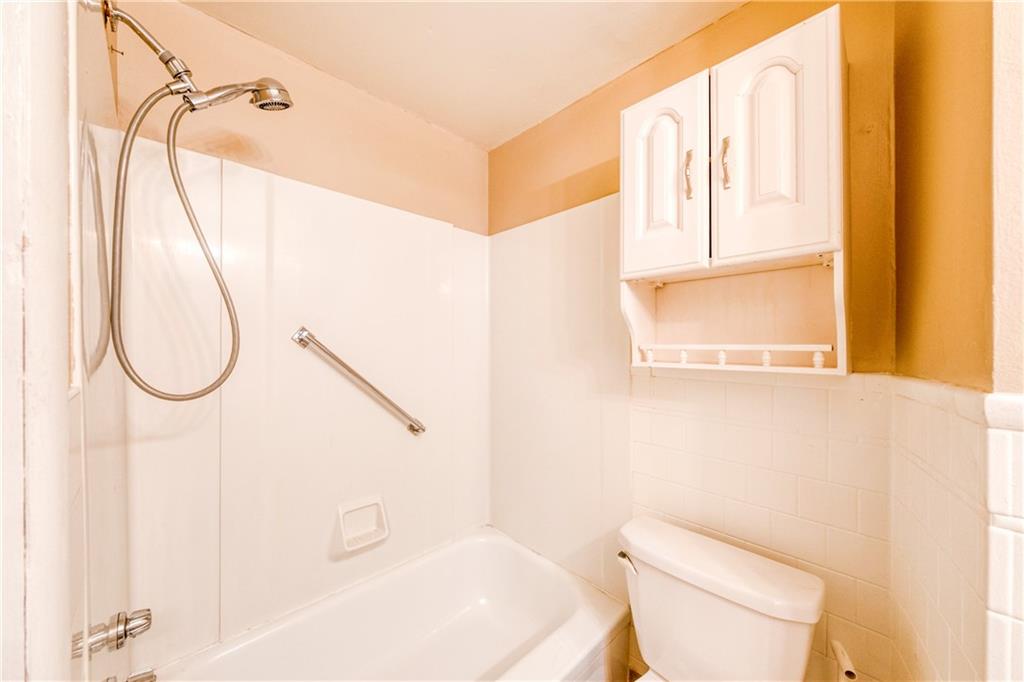 1509 Hatteras Street Pittsburgh, PA 15212 - Photo 12 of 28 a bathroom with a sink a toilet and a mirror