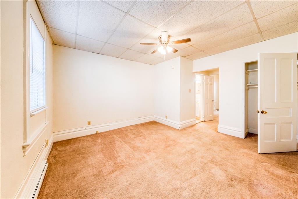 1509 Hatteras Street Pittsburgh, PA 15212 - Photo 9 of 28 an empty room with windows and fan