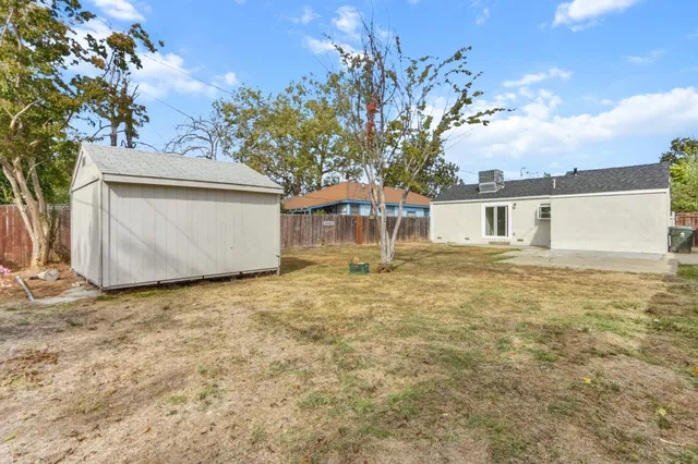 a house with trees in front of it