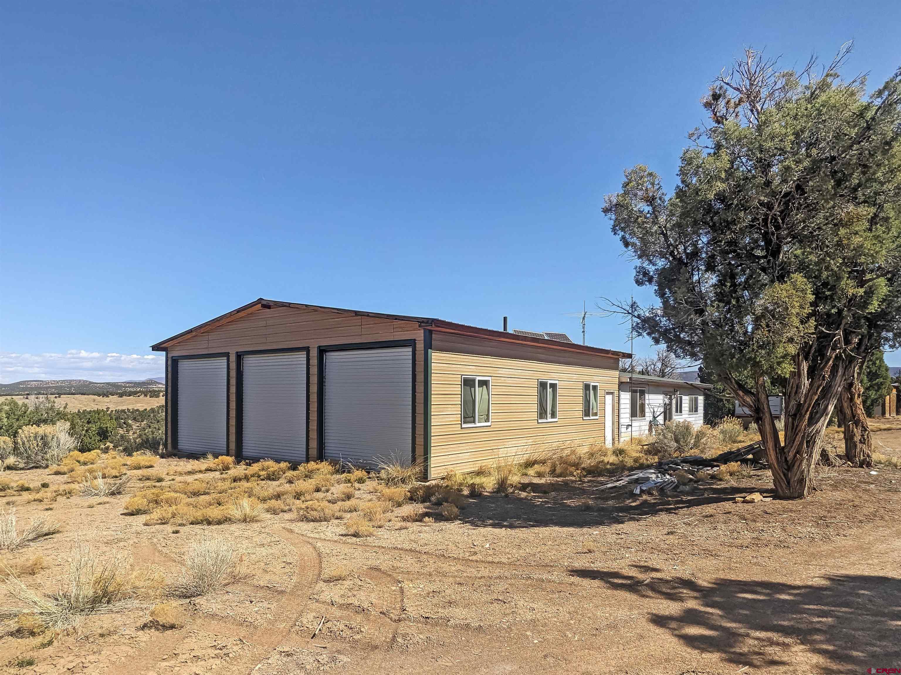 30822 Mailbox Park Road Redvale, CO 81431 - Photo 1 of 32 a front view of a house with a yard