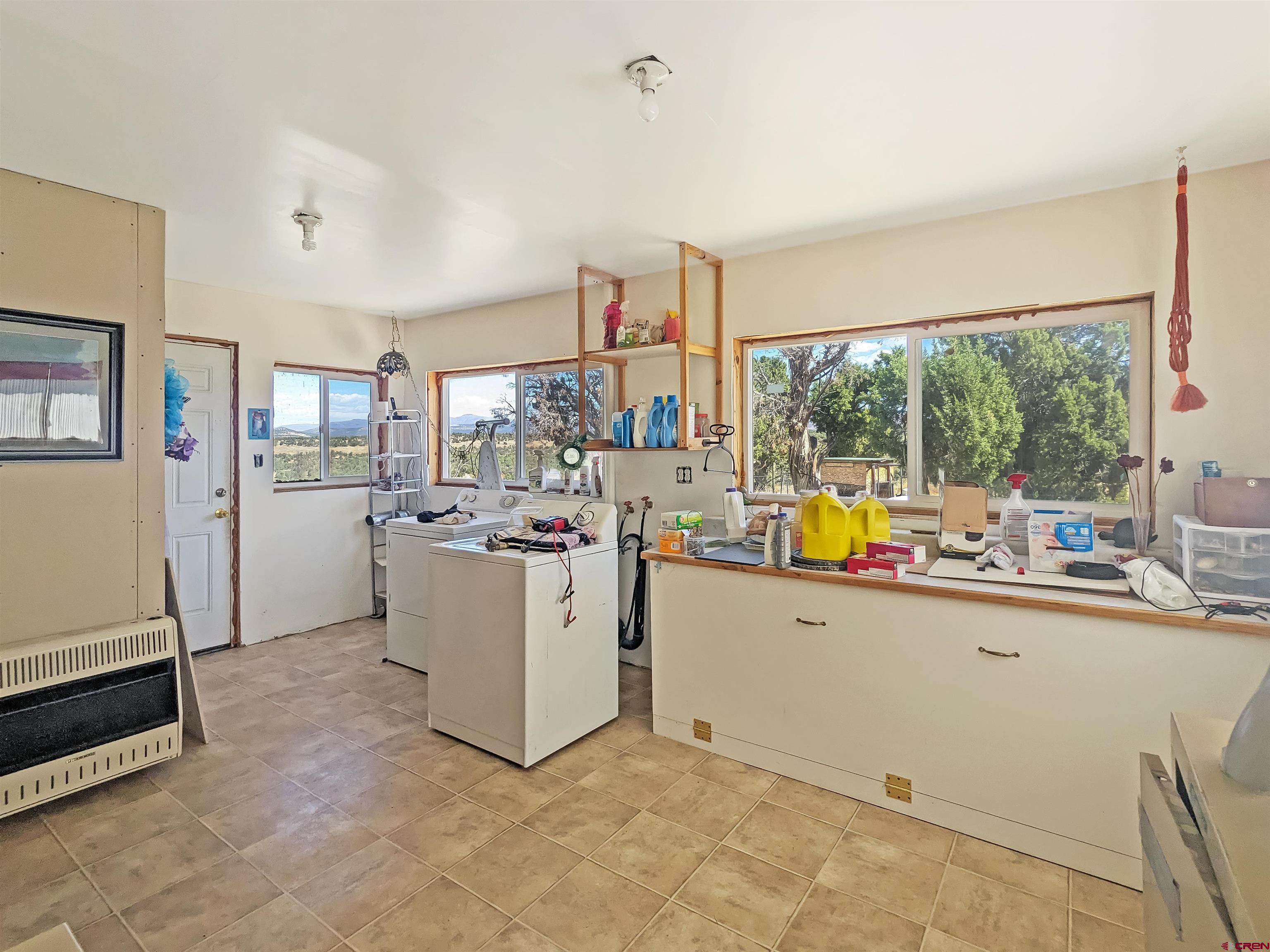 30822 Mailbox Park Road Redvale, CO 81431 - Photo 12 of 32 a kitchen that has a sink and a stove