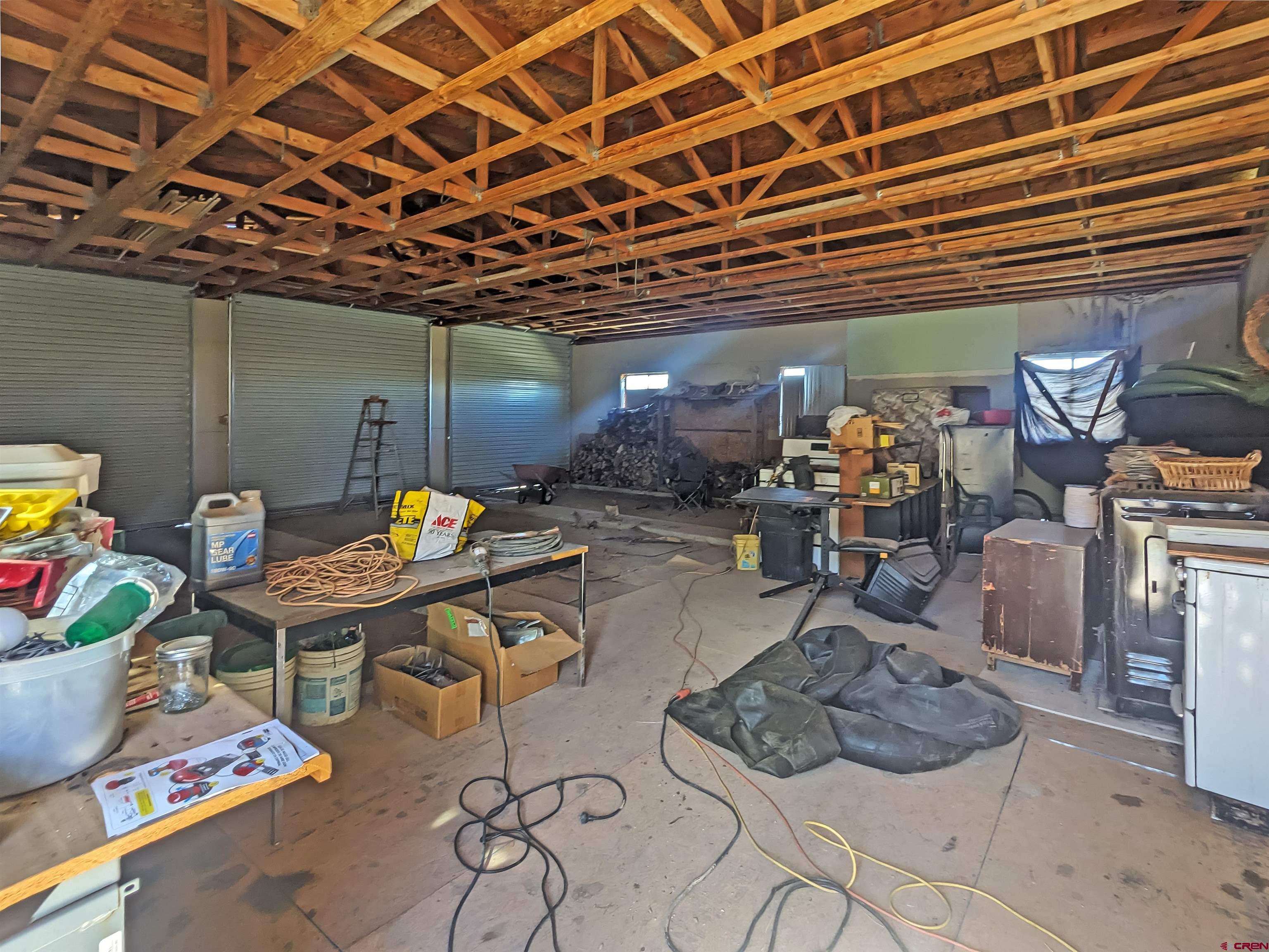 30822 Mailbox Park Road Redvale, CO 81431 - Photo 15 of 32 a room with furniture and a chandelier