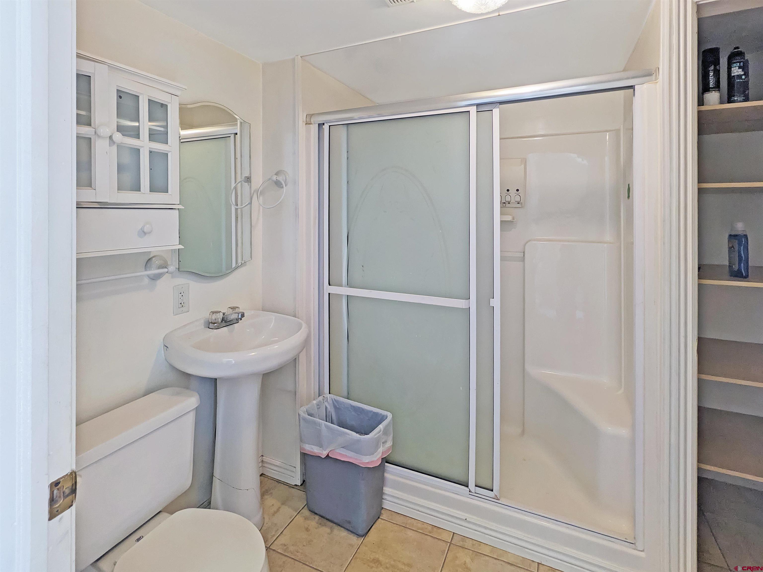 30822 Mailbox Park Road Redvale, CO 81431 - Photo 9 of 32 a bathroom with a sink toilet and shower