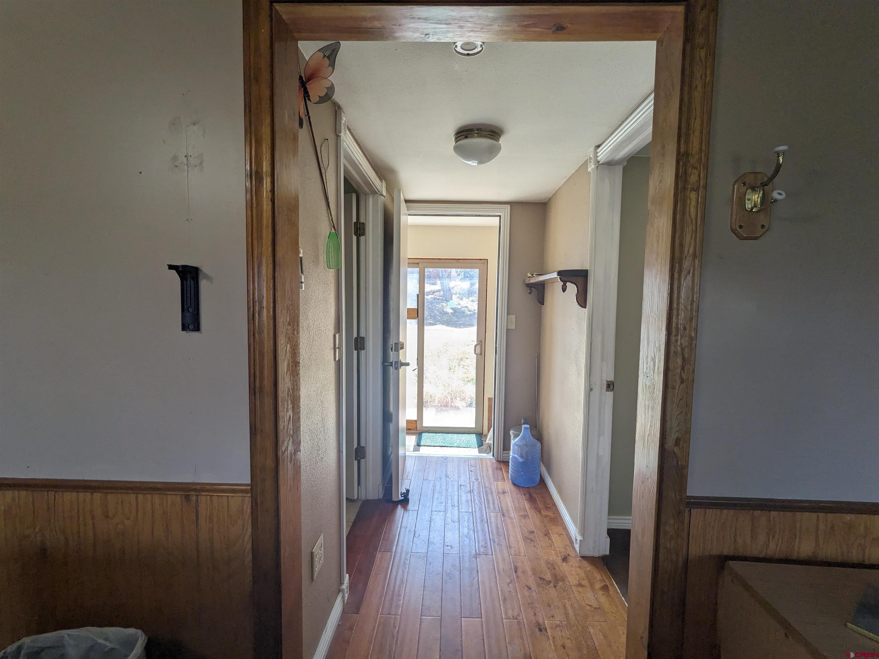 30822 Mailbox Park Road Redvale, CO 81431 - Photo 10 of 32 a view of a hallway with wooden floor and closet