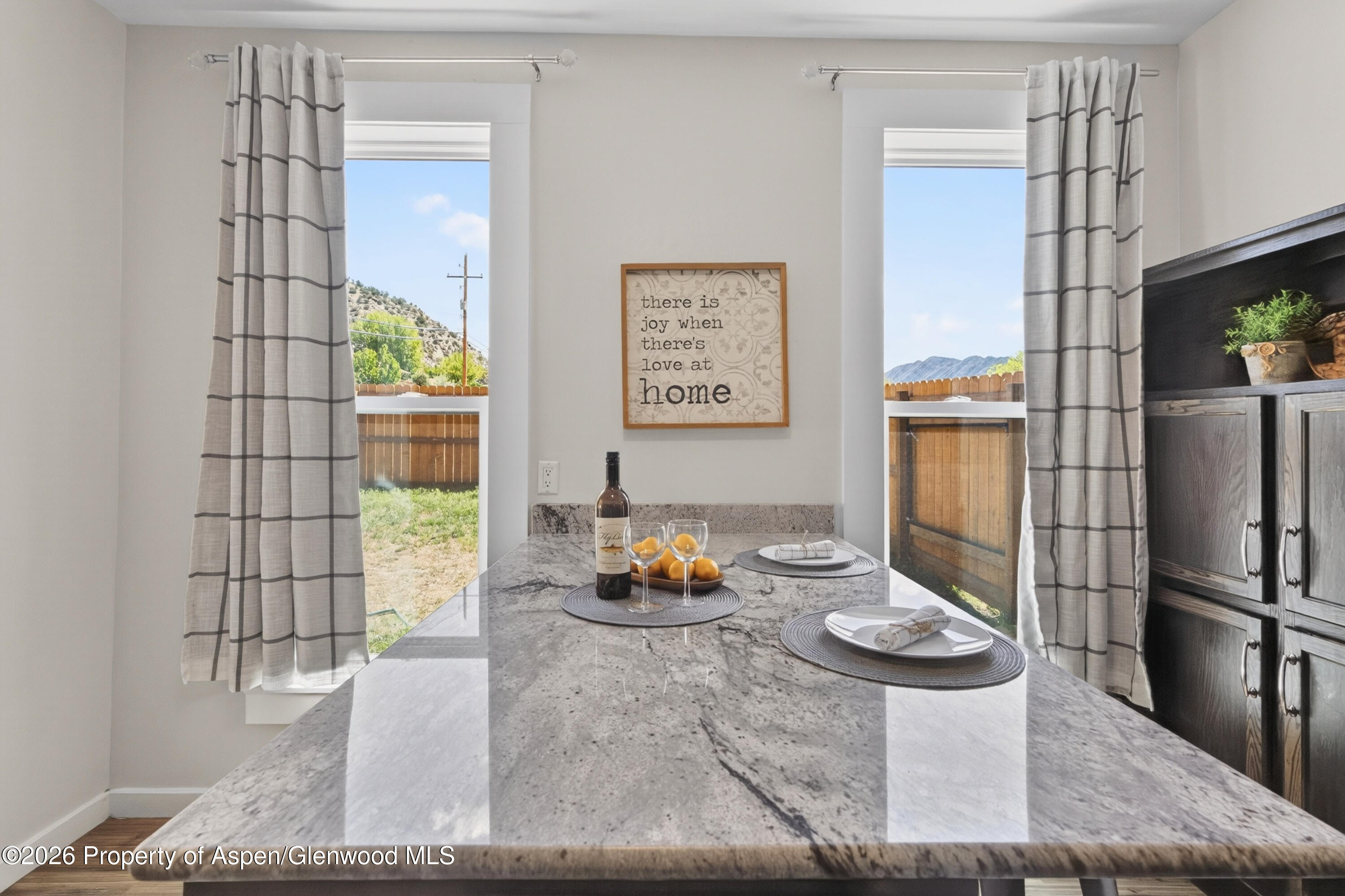 620 West Main Street New Castle, CO 81647 - Photo 15 of 27 a living room with stainless steel appliances furniture a rug and a window