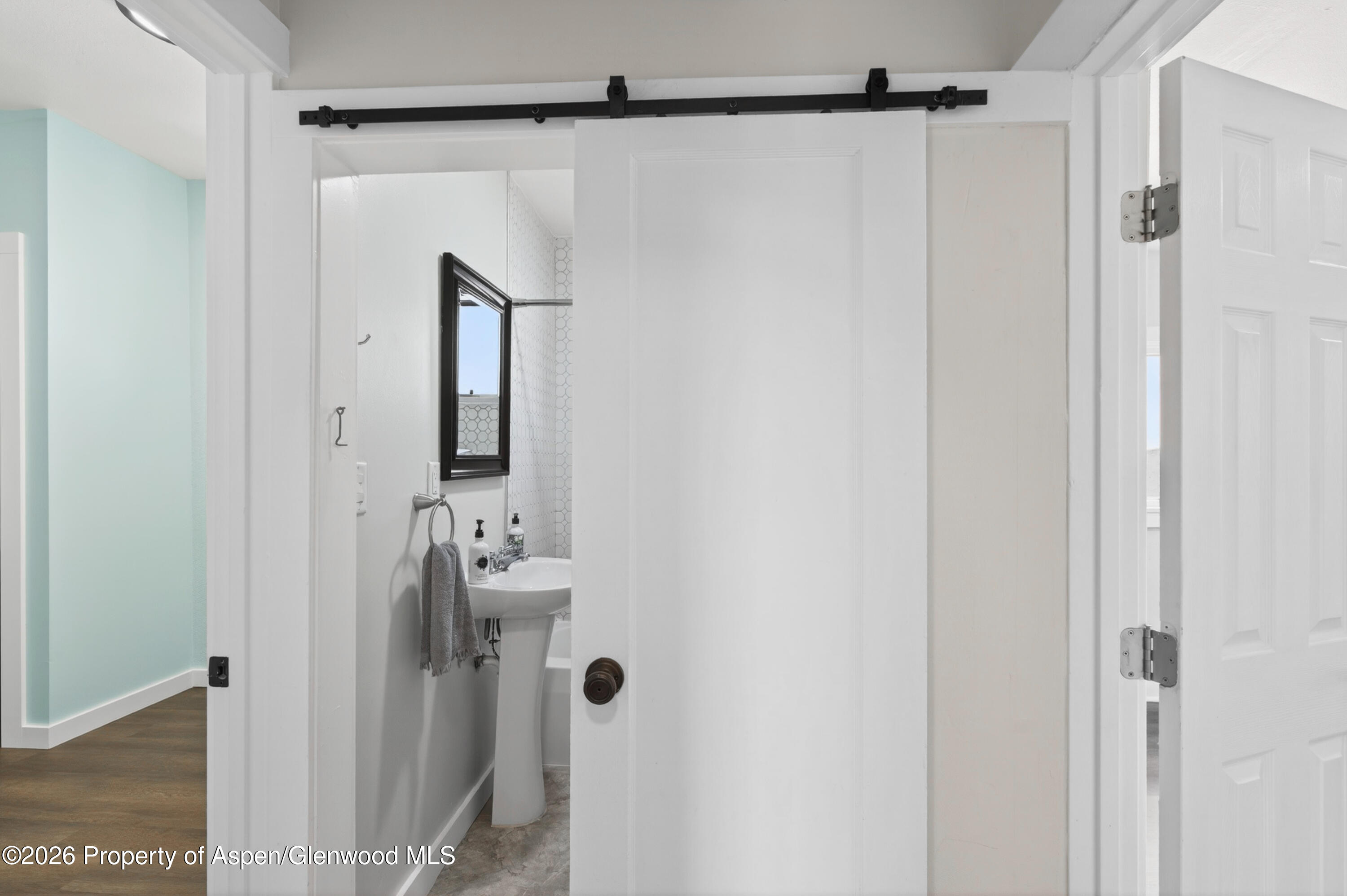 620 West Main Street New Castle, CO 81647 - Photo 17 of 27 a bathroom with a shower and a mirror