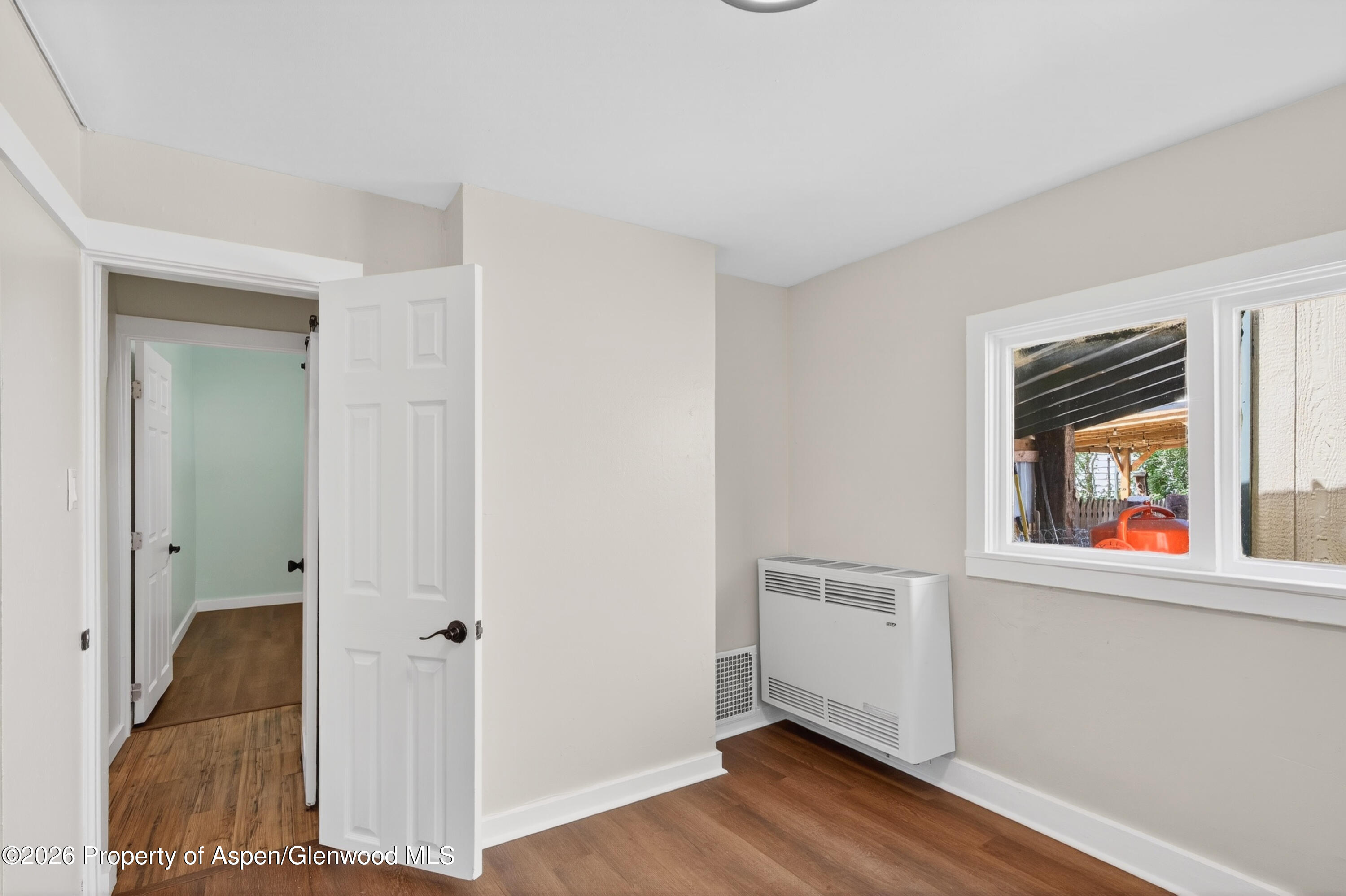 620 West Main Street New Castle, CO 81647 - Photo 22 of 27 a view of a hallway with wooden floor and closet