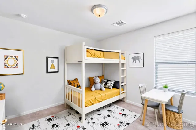 a bedroom with furniture and a window