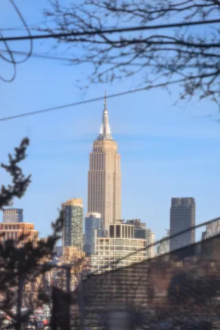 a view of empty room with floor to ceiling window and outdoor view