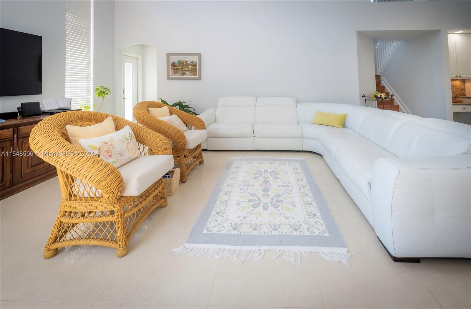 10849-10849 Bal Harbor Drive Boca Raton, FL 33498 - Photo 13 of 72 a living room with a couch and a flat screen tv