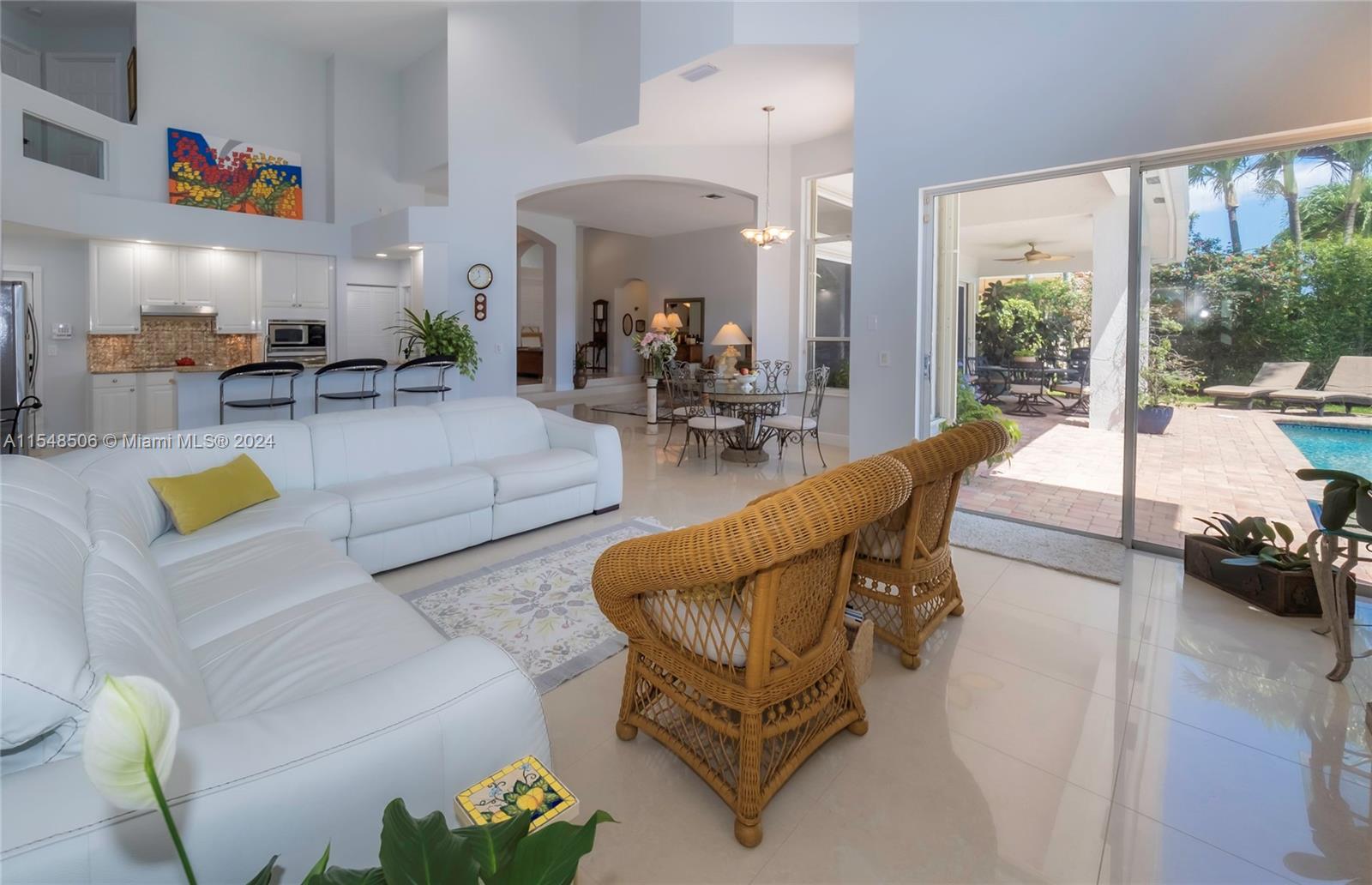 10849-10849 Bal Harbor Drive Boca Raton, FL 33498 - Photo 15 of 72 a living room with furniture and a large window