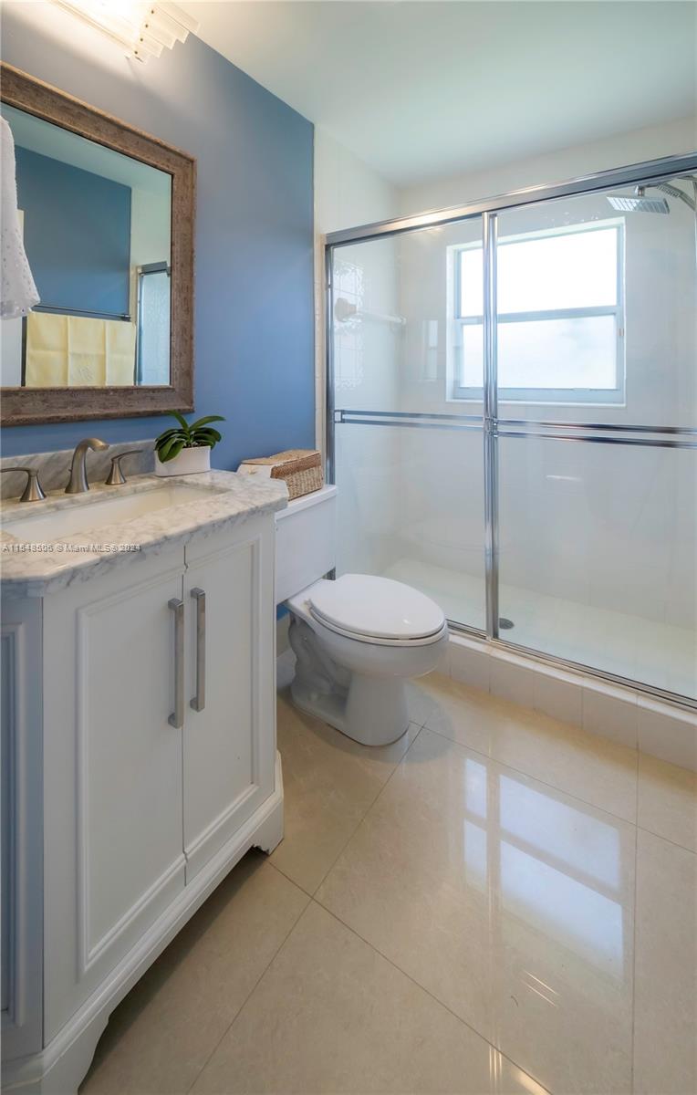 10849-10849 Bal Harbor Drive Boca Raton, FL 33498 - Photo 18 of 72 a bathroom with a sink a toilet and mirror