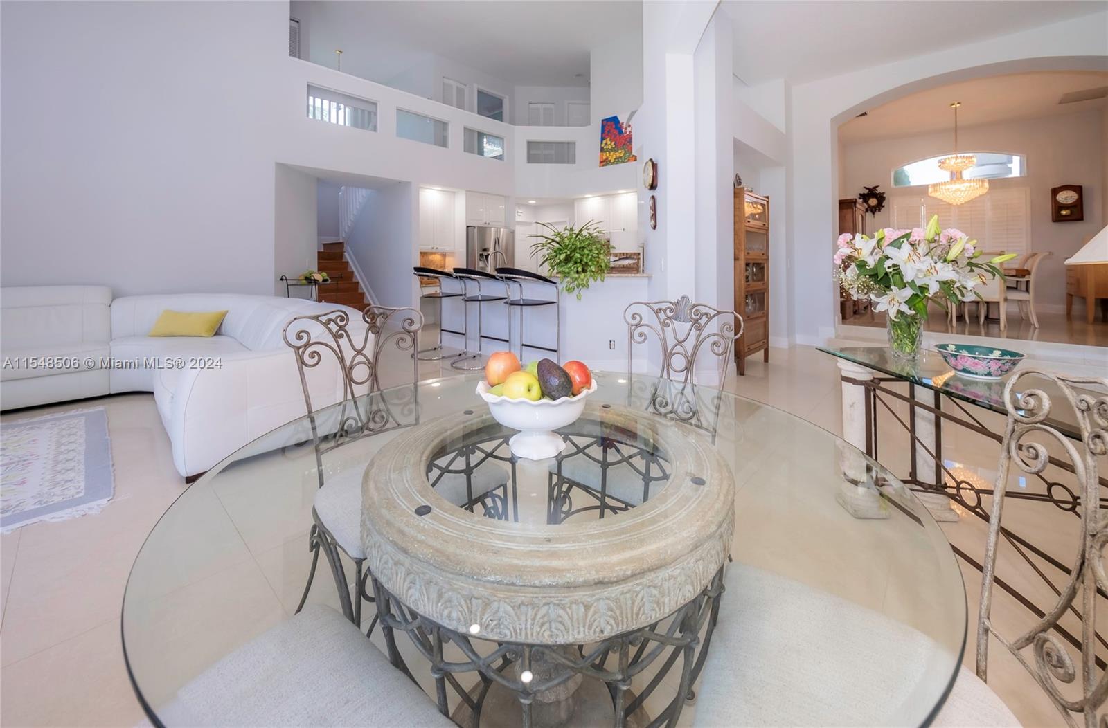 10849-10849 Bal Harbor Drive Boca Raton, FL 33498 - Photo 20 of 72 a living room with furniture and a chandelier