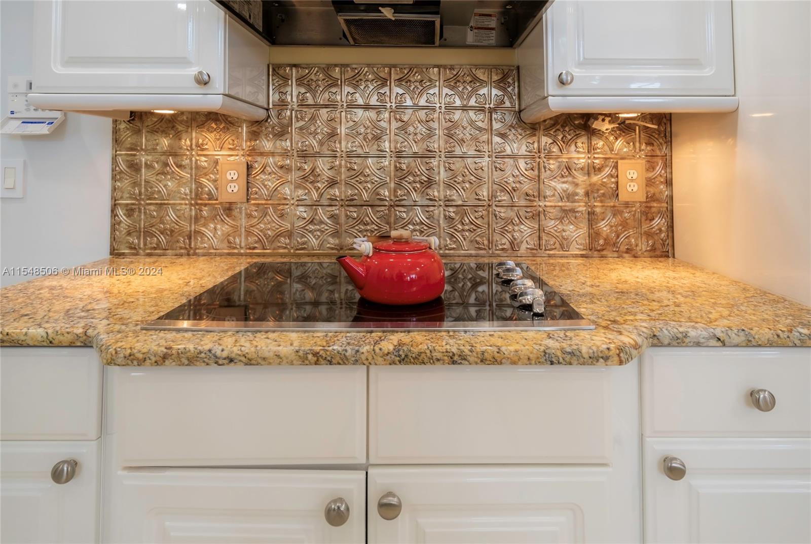 10849-10849 Bal Harbor Drive Boca Raton, FL 33498 - Photo 22 of 72 a kitchen with granite countertop white cabinets and a granite counter tops