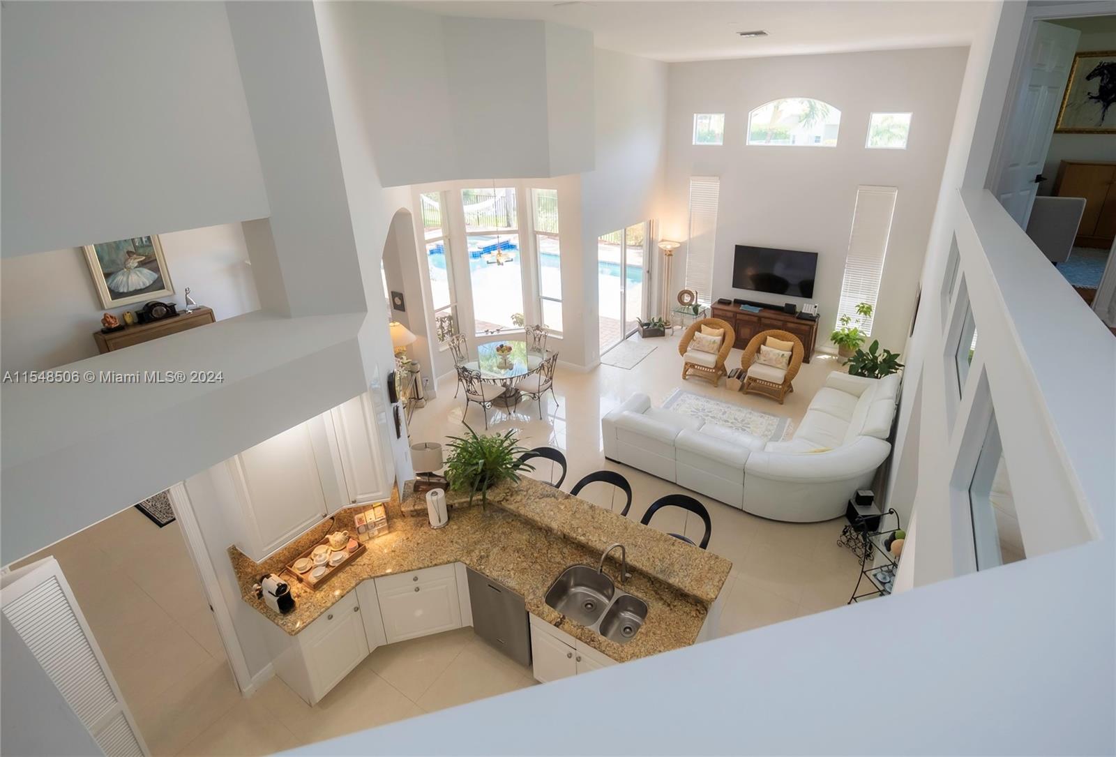 10849-10849 Bal Harbor Drive Boca Raton, FL 33498 - Photo 26 of 72 a living room with furniture and a flat screen tv